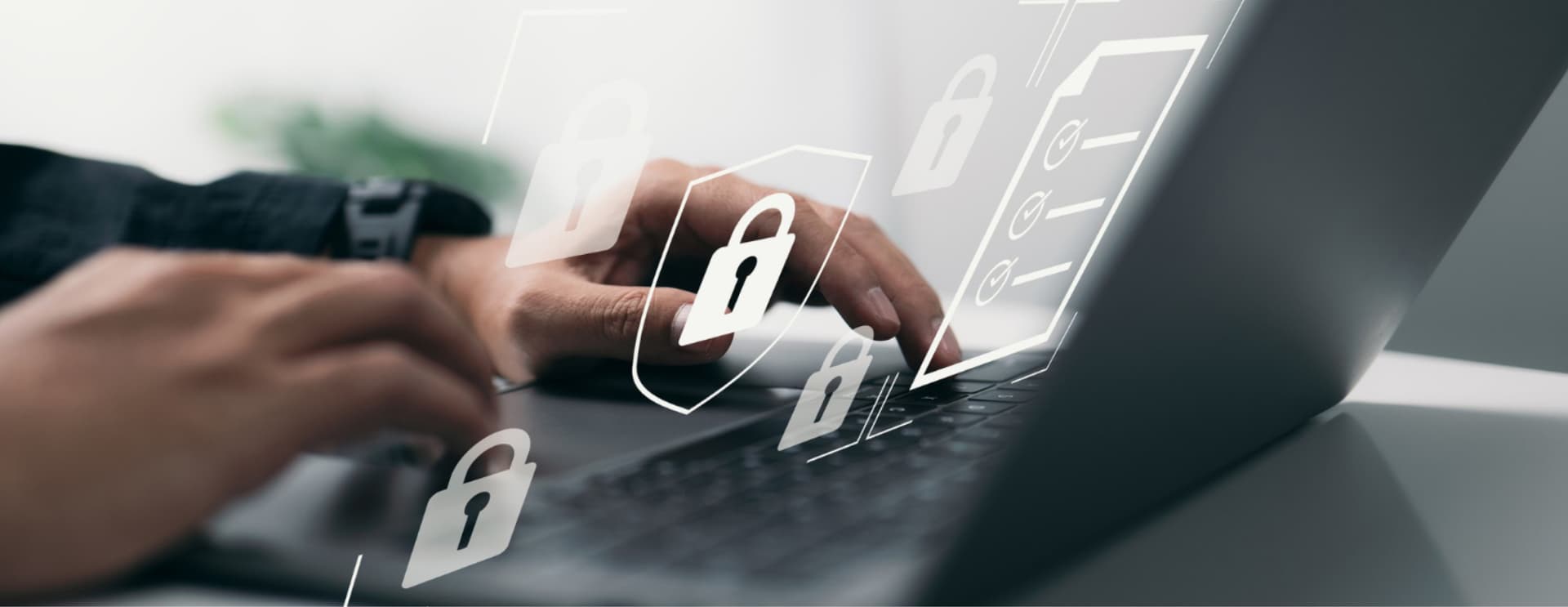 Hands typing on a laptop keyboard with digital padlock icons overlayed, symbolizing cybersecurity and data protection.