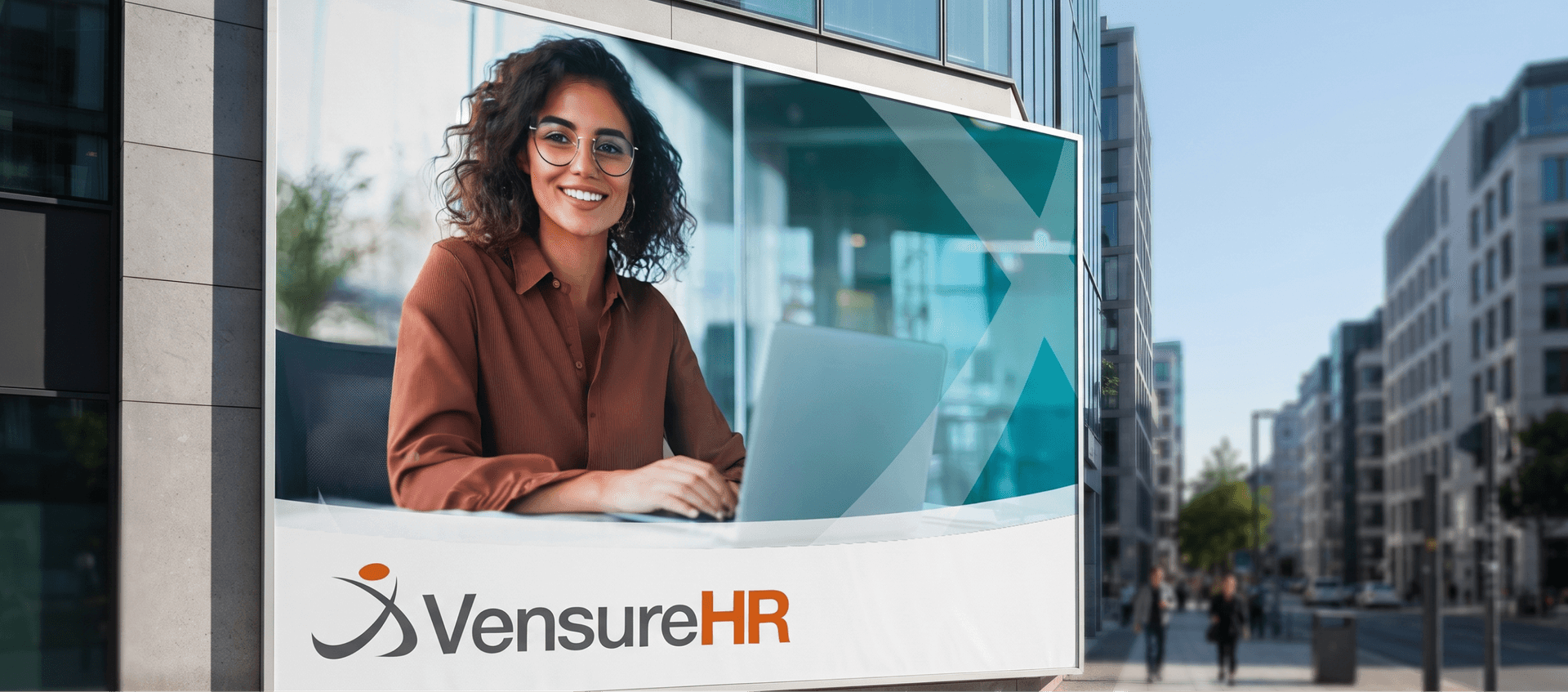 A billboard on a city street shows a woman smiling at a laptop, with the logo and name "VensureHR."