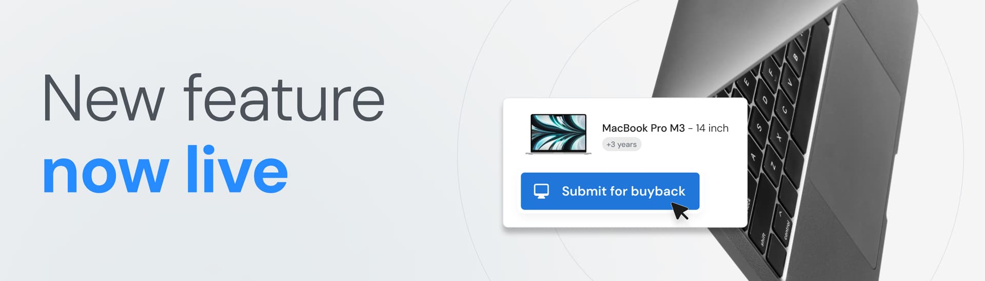 A laptop keyboard with text "New feature now live" and a button labeled "Submit for buyback" with an arrow cursor.